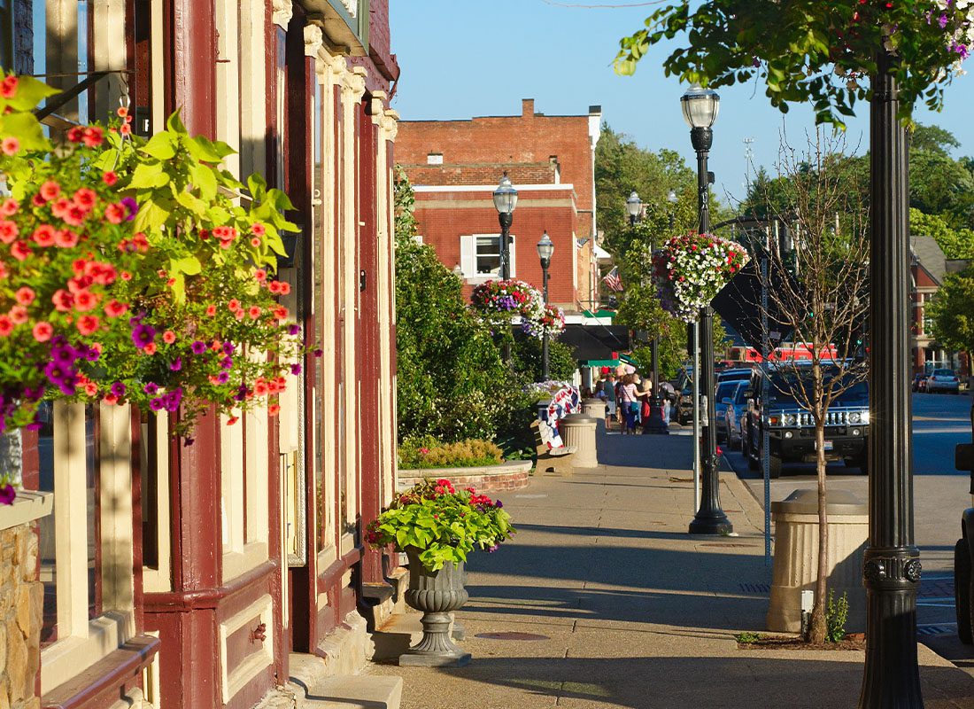About Our Agency - Scenic Shot of a Colorful Main Street During the Day